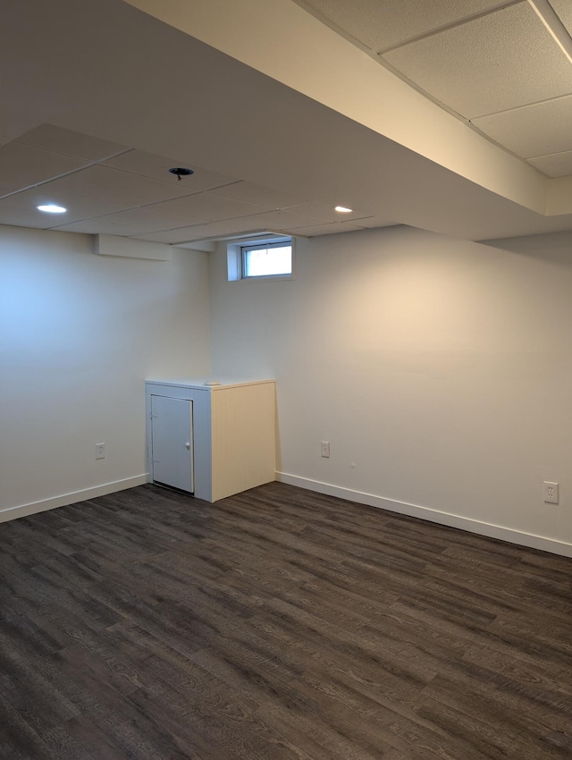 basement featuring dark wood-type flooring