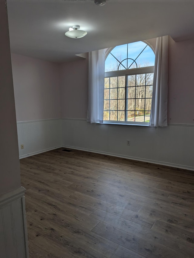 empty room with dark hardwood / wood-style floors