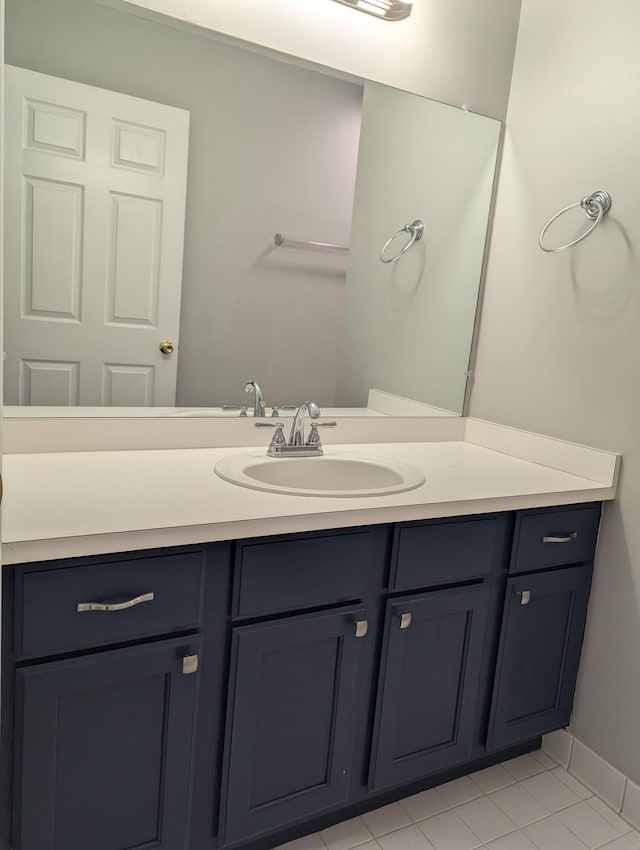 bathroom with vanity and tile patterned floors