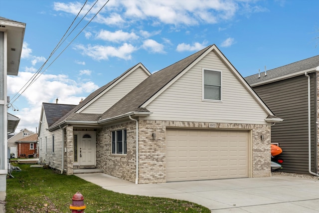 view of front property with a front yard and a garage