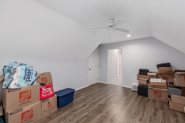 additional living space featuring hardwood / wood-style flooring, vaulted ceiling, and ceiling fan