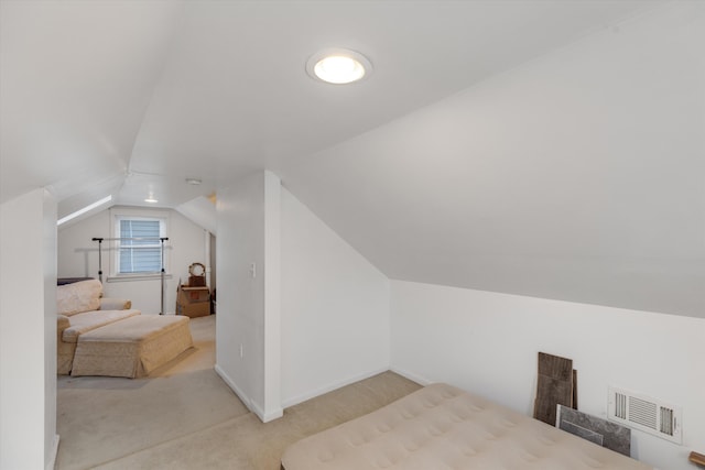 carpeted bedroom featuring vaulted ceiling