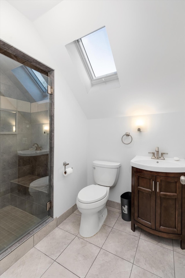 bathroom with tile patterned floors, walk in shower, vaulted ceiling with skylight, vanity, and toilet