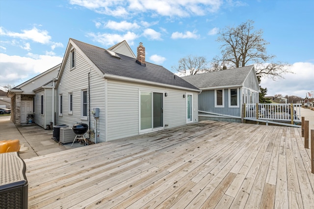 wooden deck with central air condition unit