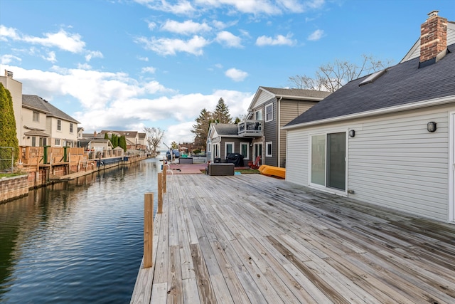 wooden deck with a water view