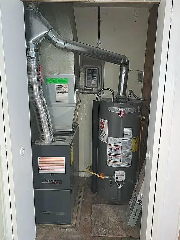 utilities featuring gas water heater and heating unit