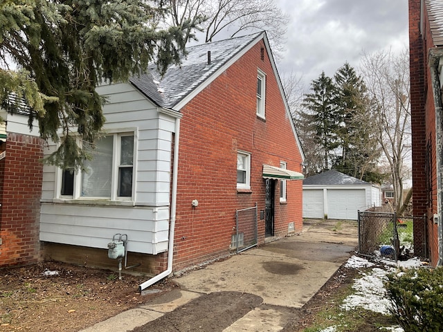 view of home's exterior with an outbuilding and a garage