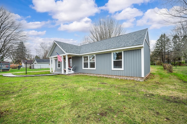 view of front of property with a porch and a front lawn