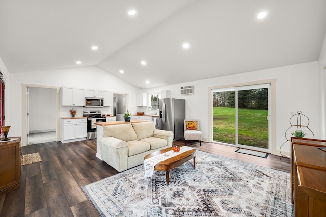 living room with dark hardwood / wood-style floors and vaulted ceiling