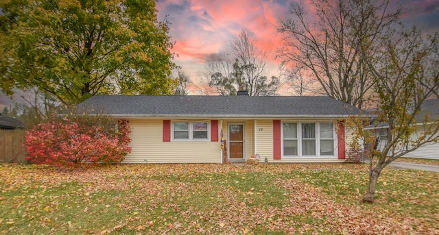 ranch-style house featuring a lawn