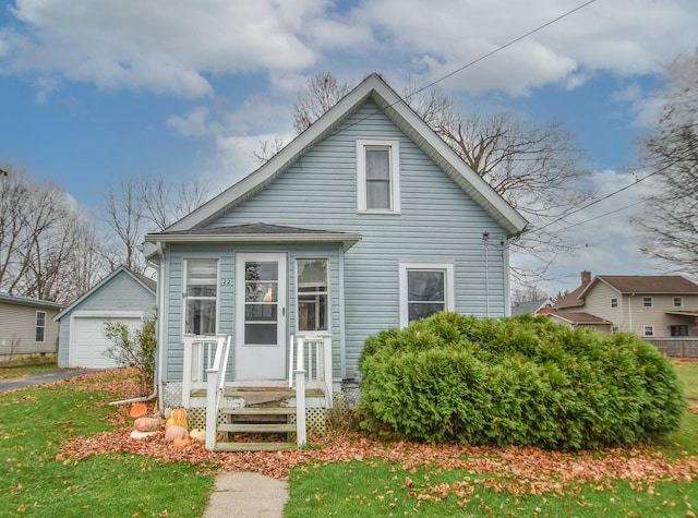 bungalow with an outbuilding and a garage