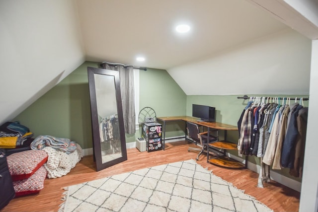 office featuring wood-type flooring and lofted ceiling