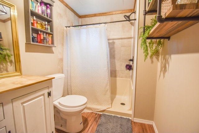 bathroom with curtained shower, toilet, vanity, and hardwood / wood-style flooring