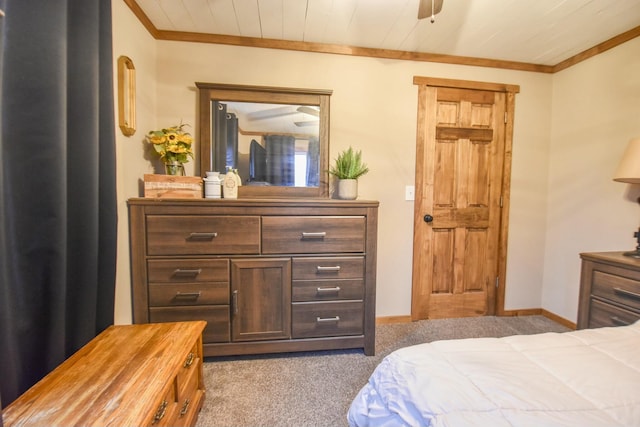 carpeted bedroom with crown molding and wooden ceiling