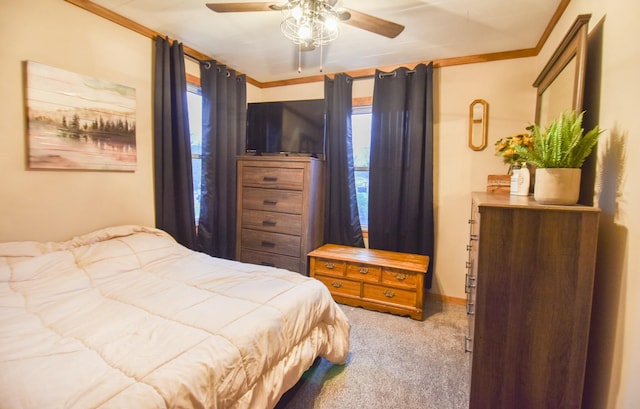 bedroom with multiple windows, light carpet, ceiling fan, and ornamental molding