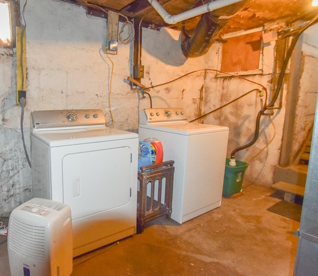 washroom with independent washer and dryer