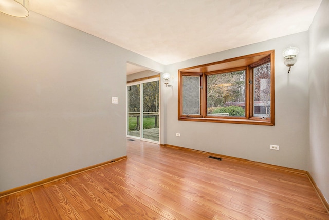 spare room with light wood-type flooring