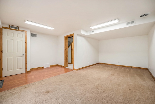 basement featuring wood-type flooring