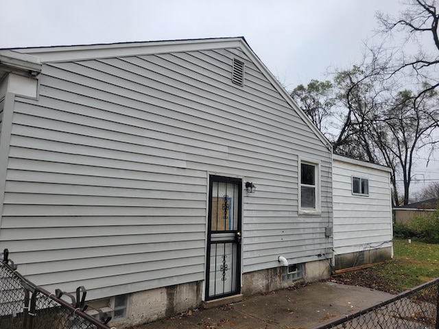 view of side of property with a patio