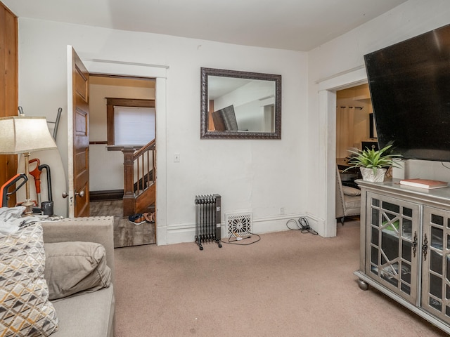 living room with carpet flooring and radiator heating unit