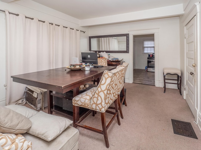 view of carpeted dining space