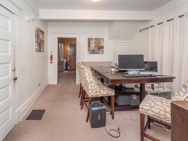 home office featuring beam ceiling and light colored carpet