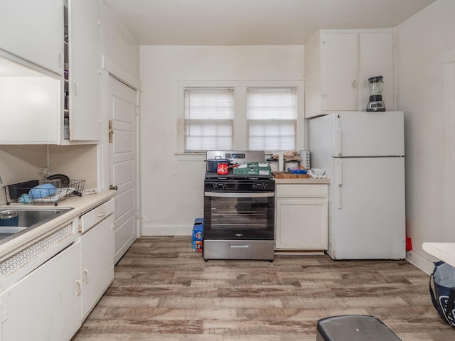 kitchen with white cabinets, white appliances, and light wood-type flooring