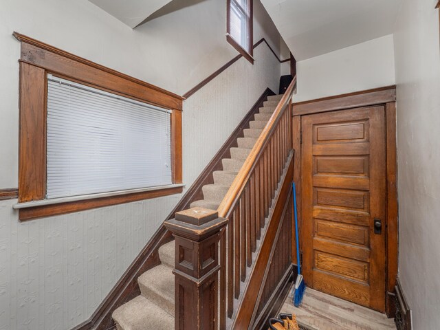 stairway featuring hardwood / wood-style floors