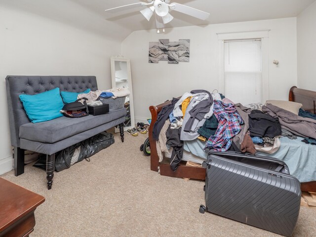 bedroom featuring ceiling fan, light colored carpet, and lofted ceiling