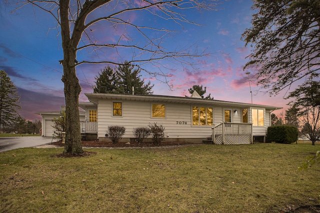 view of front of home featuring a lawn