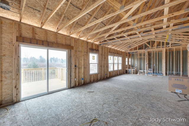 miscellaneous room with plenty of natural light and vaulted ceiling