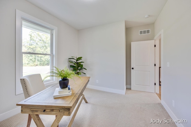 office area with light colored carpet