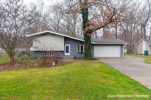 view of front of house featuring a garage and a front lawn