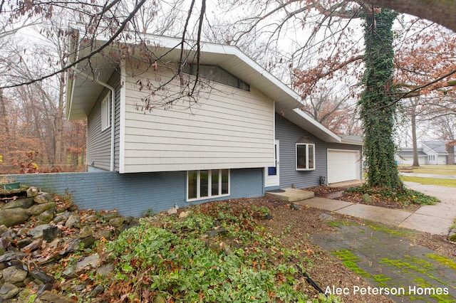 view of side of home with a garage