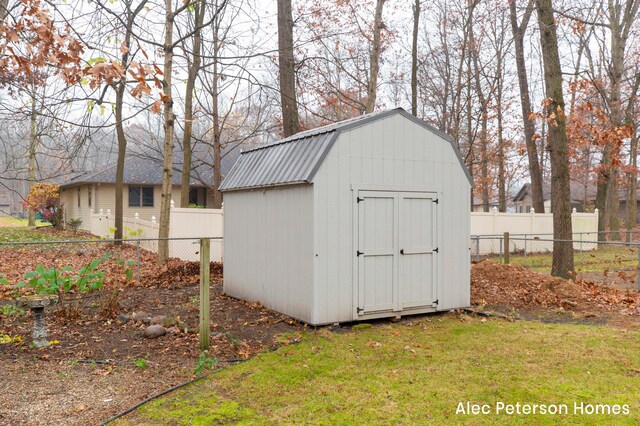 view of outbuilding with a lawn