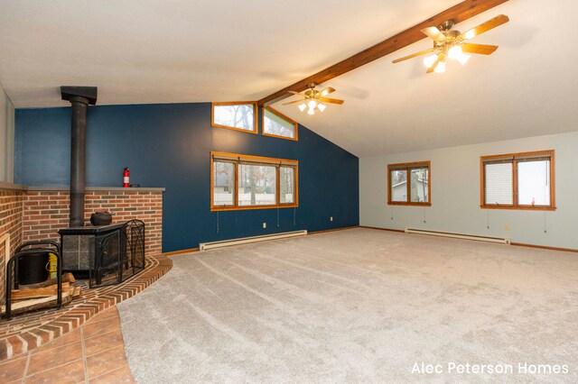 carpeted living room featuring lofted ceiling with beams, ceiling fan, a wood stove, and a baseboard heating unit