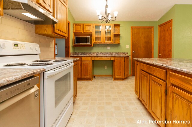 kitchen featuring light stone countertops, hanging light fixtures, an inviting chandelier, stainless steel dishwasher, and white range with electric stovetop