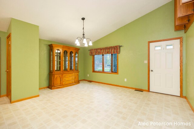 interior space with vaulted ceiling and a notable chandelier