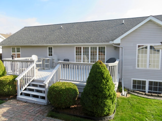 back of house featuring a wooden deck