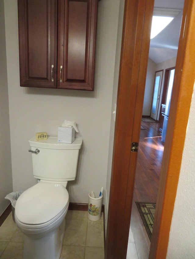 bathroom with tile patterned flooring and toilet