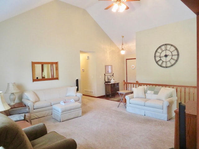 carpeted living room featuring ceiling fan and high vaulted ceiling