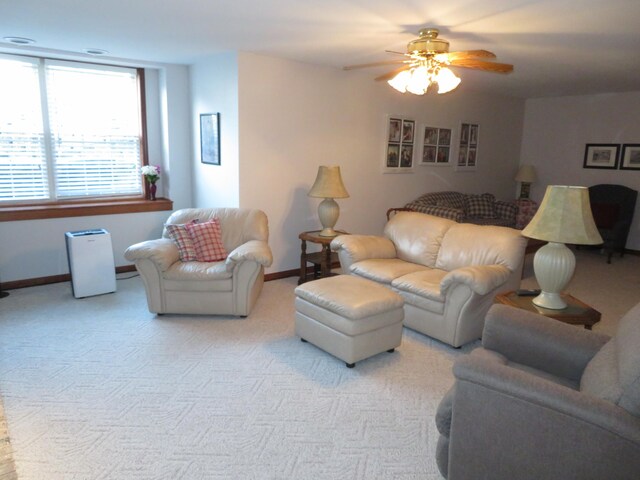 living room featuring ceiling fan and light carpet