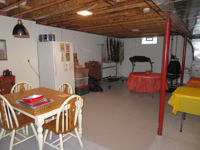 interior space with white fridge with ice dispenser