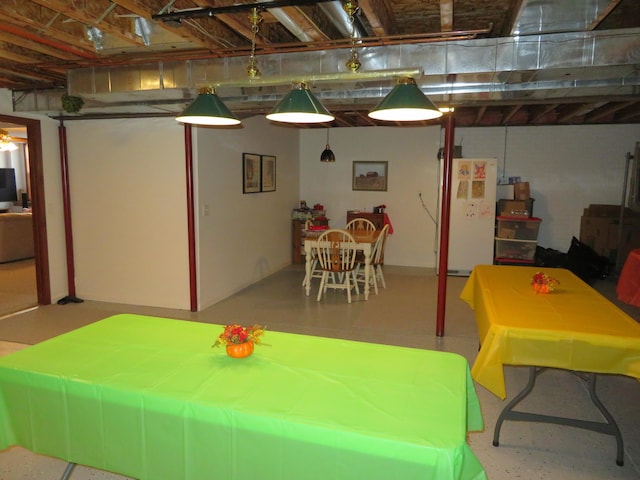 basement with white fridge