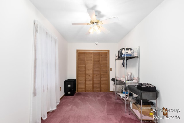 misc room with carpet and ceiling fan