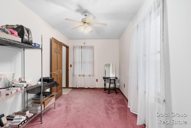 miscellaneous room with ceiling fan and carpet floors