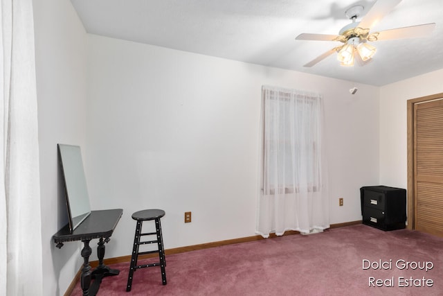 interior space with carpet flooring and ceiling fan