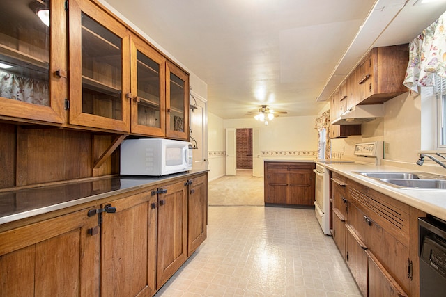 kitchen with ceiling fan, white appliances, and sink