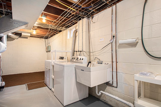 laundry room featuring washing machine and dryer and sink