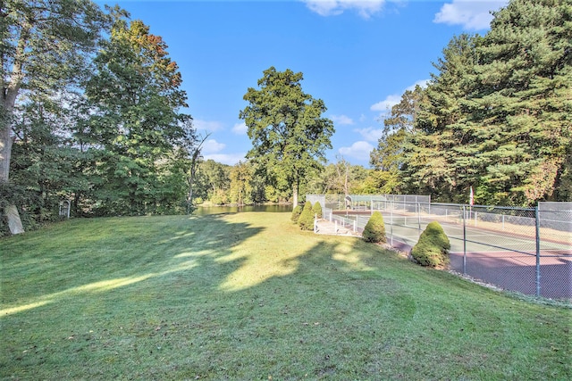 view of yard with tennis court